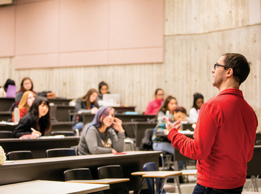 York Professor standing in front of a classroom speaking