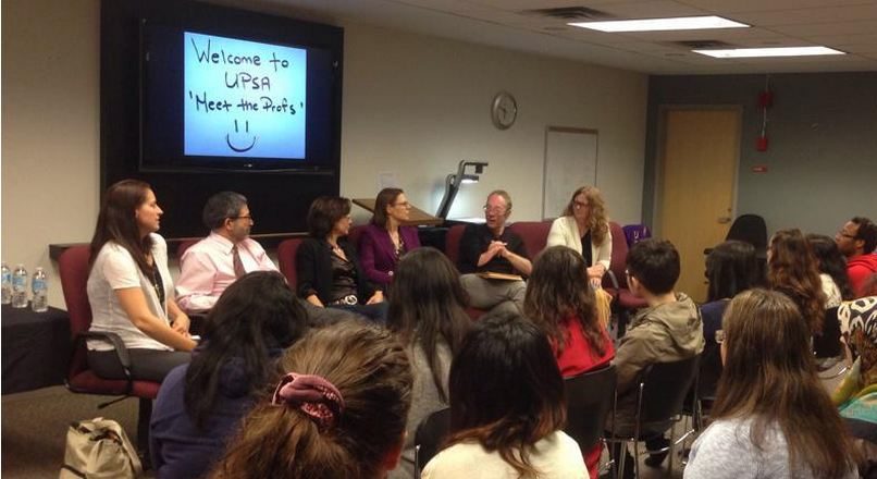 A panel of professors introducing themselves to a class of students