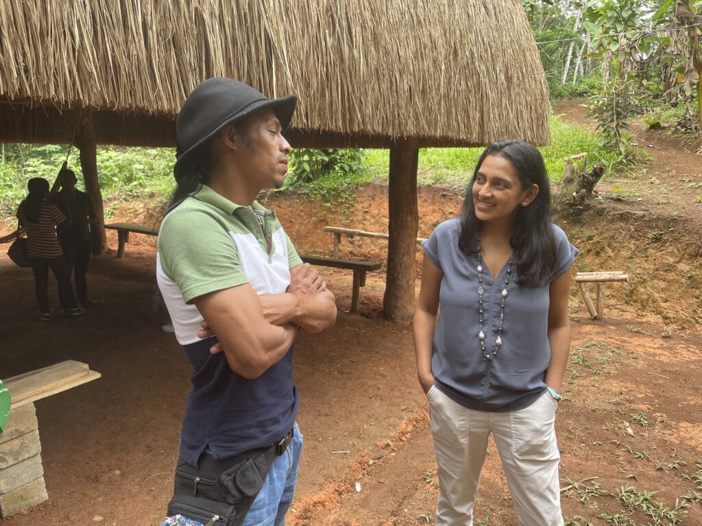 Professor Amrita Daftary speaking with a man in Costa Rica
