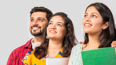 Students smiling with work binders