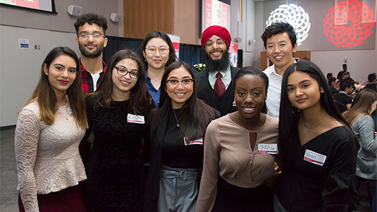 multicultural students pose for a photo during a networking event at York University.