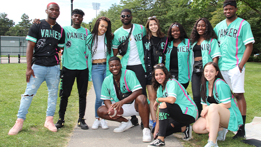 Vanier College students group together for a photo during orientation on Keele Campus
