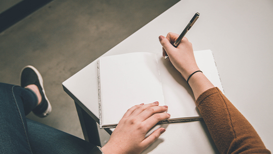 close up of person taking notes