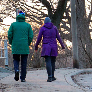 two people walking outside in winter
