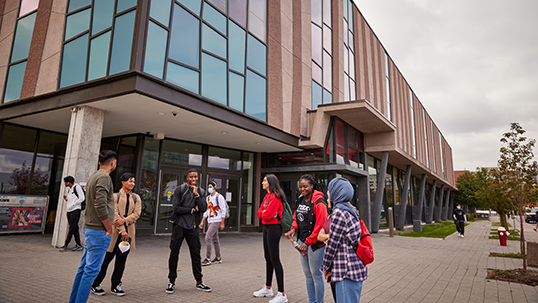 group of students in front of accolade building