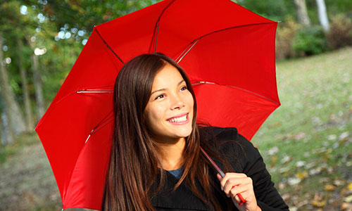 Asian student under the red umbrella