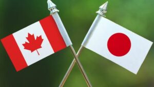 Canadian and Japanese flags crossing