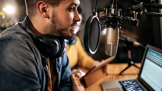 podcaster host speaking into mic