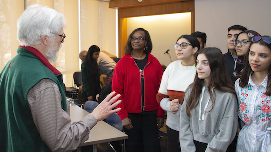 professor interacting with young people