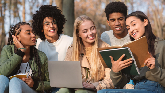 group of happy young student studying outside