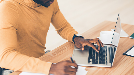 close up of person using laptop