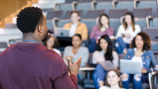 professor teaching in front of class