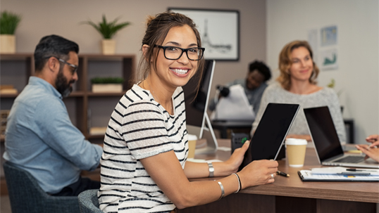 happy young female student using tablet computer