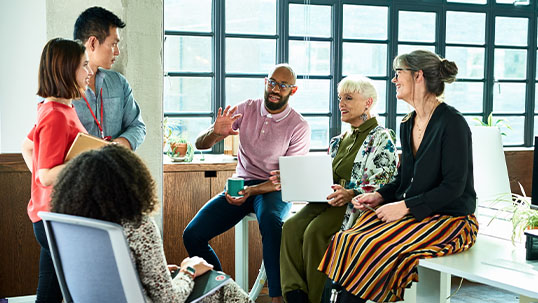 diverse group of professionals have brainstorming session in an office