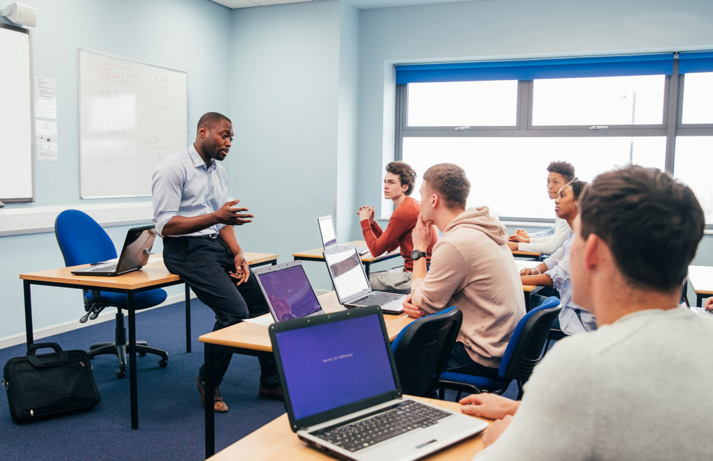 professor and small class in tutorial