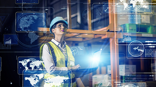 woman in hard hat and high visibility vest in supply warehouse