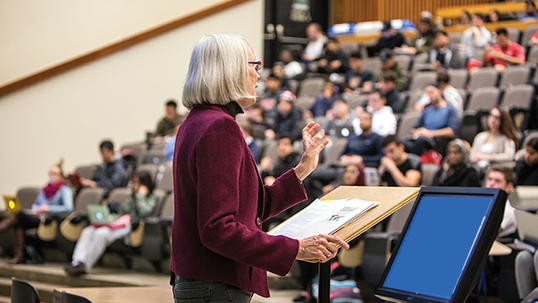 female professor lecturing to students