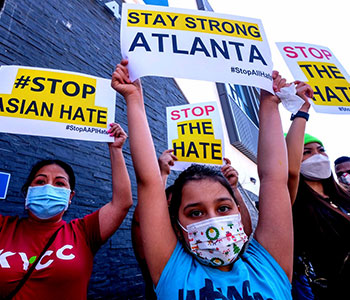 protesters with stop Asian hate crime signs