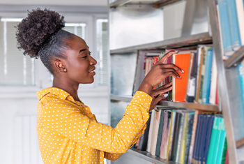 black woman shelving books