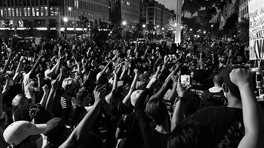A group of people protesting in the streets