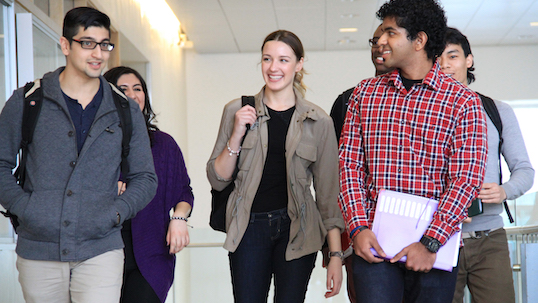 York University students walking through hallway between classes