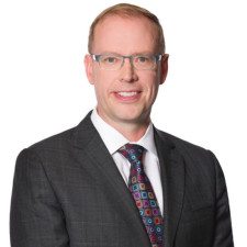 Jason Reynar 550x550 A Photo of Jason Reynar in a suit smiling