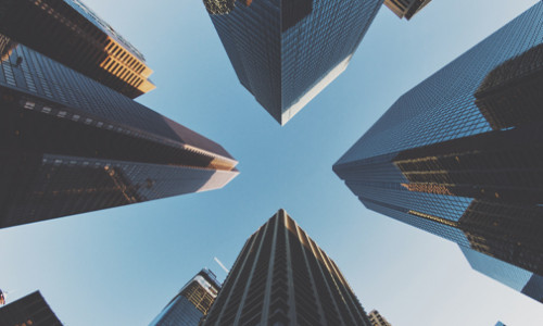 Economics looking up at business towers