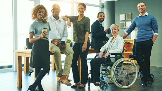 a group of diverse people posing for equity inclusion