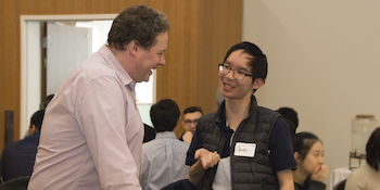 Dean & Professor JJ McMurtry meet a student in the Dean Circle