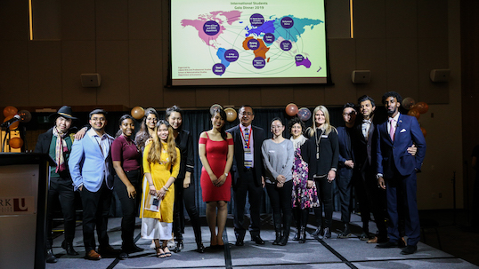 A wide shot of International students and professors at the International Student Awards