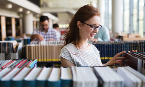 Linguistics focus on woman browsing library books