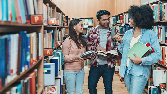 three students in the library