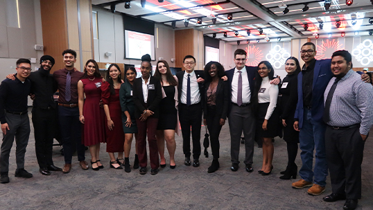 Professional public policy and administration students pose for a group photo