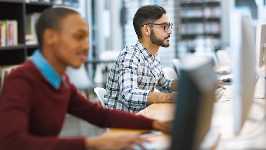 two people on computers