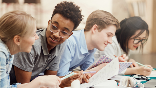 Group of students studying for an examination.