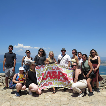 Students pictured with the LA&PS flag in Athens. Photo credit: history student Christina Coutsougeras