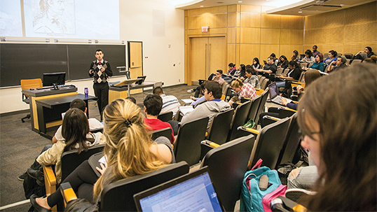 Male professor teaches a class in a lecture hall at Keele campus