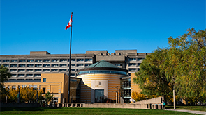 Vari Hall with Canadian flag in front