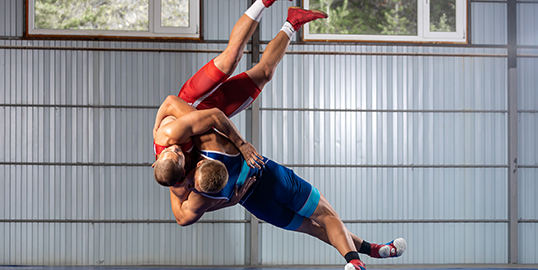 two male person wrestling