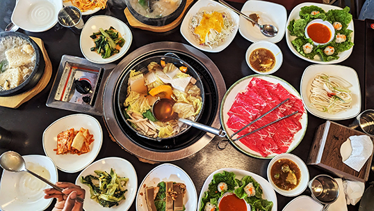 Table covered in South Korean food dishes