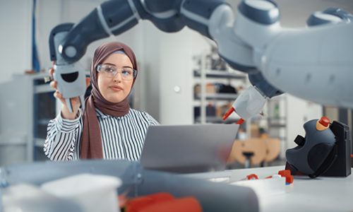 female student working with a robot