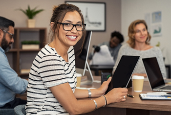 side shot of a professor at the podium during a lecture
