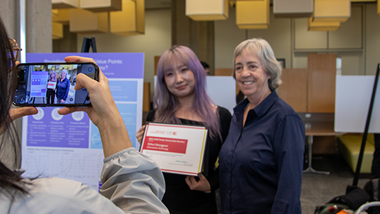 Interim Dean Kathryn Mcpherson poses with a DARE winner