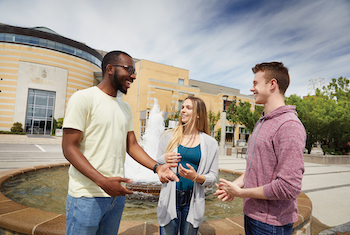 three students in conversation outside at York Keele campus