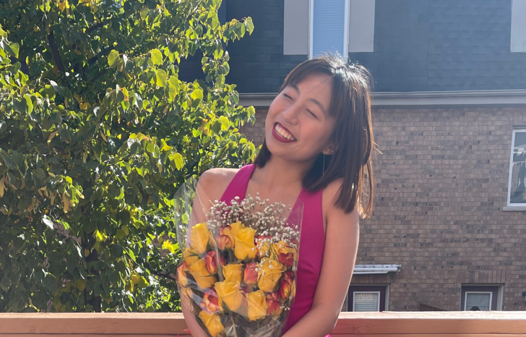 Annie Park holds a bouquet of flowers