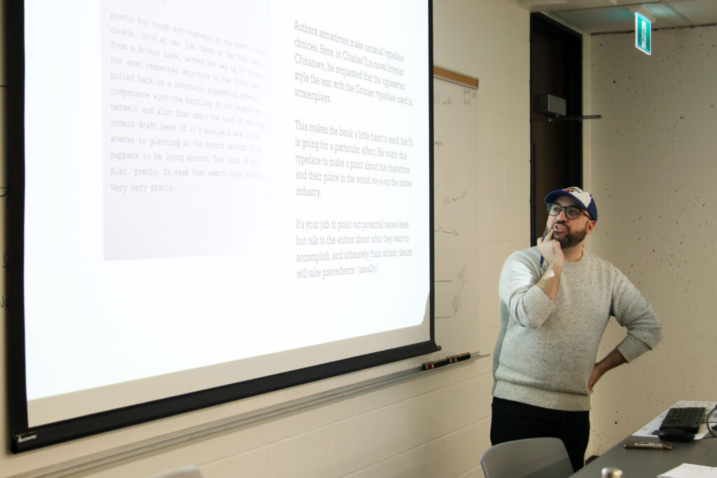 Professor explaining their slide in class