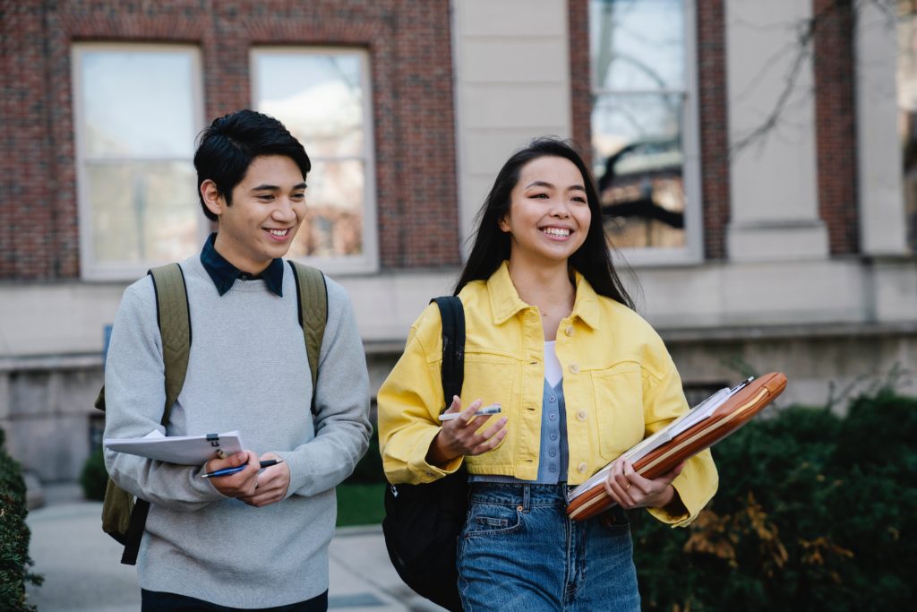 Two students walking outside