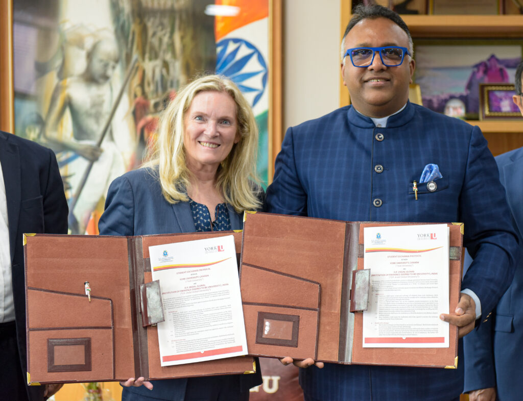 image of York University President and Vice-Chancellor Rhonda Lenton and Jindal Global University Vice-Chancellor holding MOU signed by the two universities