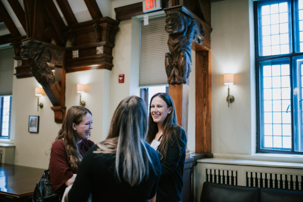 Three students gather and chat during a PBSC event