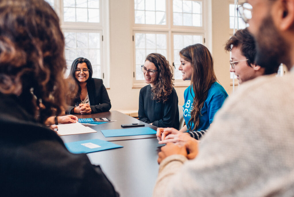 PBSC volunteers gather to speak to each other at a meeting